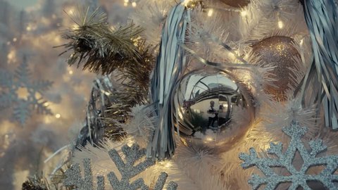 Greeting Season concept. Gimbal shot of ornaments on a Retro Christmas tree with decorative light in 4k (UHD)