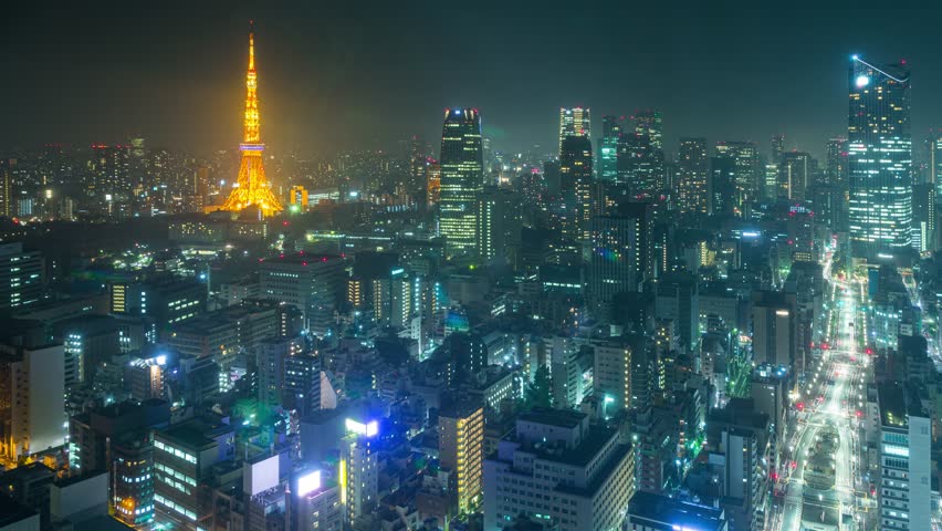 Night time lapse of Tokyo Japan. The Tokyo Tower can be seen in the distance.