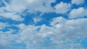 4K : Blue sky timelapse - Time-lapse captures the heartbeat of the sky, pulsating with energy as clouds swiftly traverse the vivid canvas, a vibrant display of nature's rhythm. Winter sky background.
