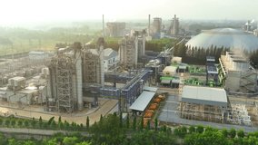 A Combined-Cycle Power Plant integrates gas and steam turbines, achieving high thermal efficiency and electricity production through sequential energy conversion. Aerial view drone. 4K.
