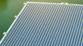 Aquatic Solar Farms: Revolutionizing renewable energy, floating photovoltaics deploy solar panels on water bodies, increasing sustainability. Aerial view drone.
