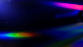 The green laser beam slides over the surface of the compact disk and reads the data on black background. Colorful reflections on the disc. Macro. Closeup. Shallow depth of field
 - Powered by Shutterstock - Get 15% off with code: PIKWIZARD15