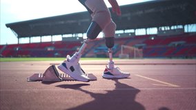 Disabled athletes prepare in starting position ready to run on stadium track - Powered by Shutterstock - Get 15% off with code: PIKWIZARD15
