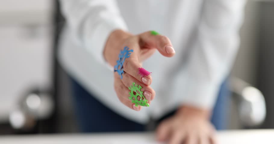 Woman stretching out hand with coronavirus molecules in office closeup 4k movie slow motion. Hygiene during covid19 pandemic concept | Shutterstock HD Video #3391083793