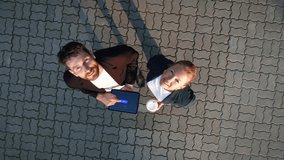 Big City Business Partners Use Tablet Computer. E-Commerce Visualization Global Business Opportunities Concept. Top-Down Zoom out Aerial Drone Shot - Powered by Shutterstock - Get 15% off with code: PIKWIZARD15