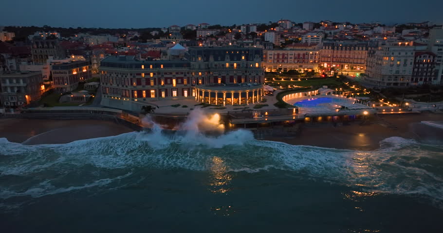 Biarritz large aerial view of the main beach and Biarritz city at night France. Everything along the coast is in lights and illumination