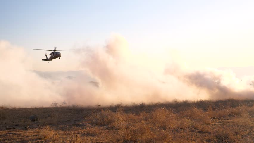 Israeli Blackhawk Helicopter landing in Gaza on field designated by smoke
