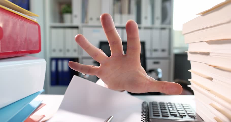 Man hand reaches along documents and folders on desktop. Raider business takeover concept Royalty-Free Stock Footage #3391313827