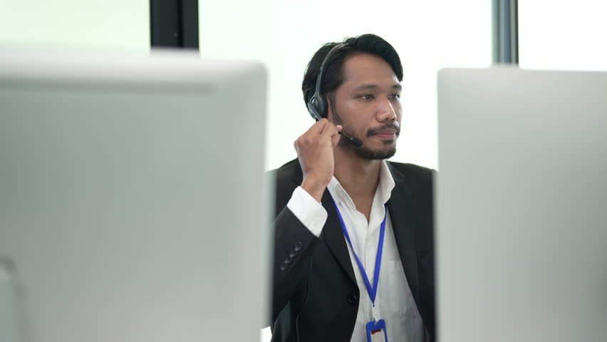 Call center worker.  businessman telemarketer telesales agent wear wireless headset make conference video call 
 Royalty-Free Stock Footage #3391353323