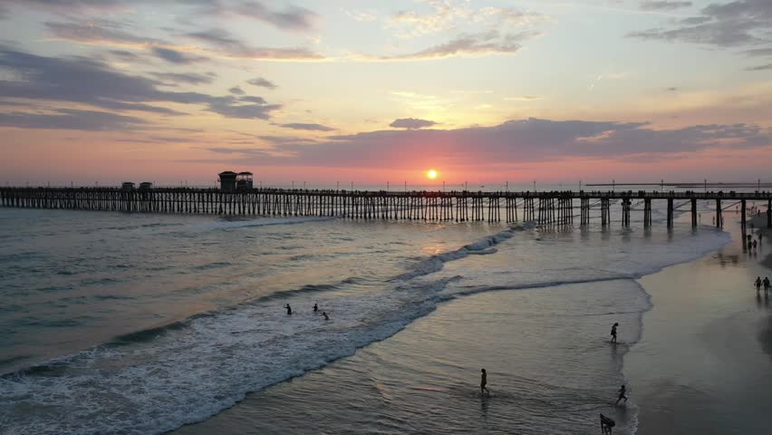 Sunset and surfing near the Oceanside Pier