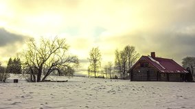 Wooden log cabin in the woods of snow covered Riga, Latvia Time lapse sunset - Powered by Shutterstock - Get 15% off with code: PIKWIZARD15
