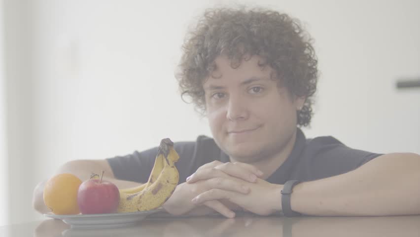 person holding a basket of fruit
