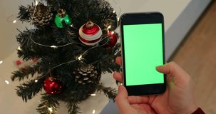 Christmas tree green screen browsing chroma key woman hand christmas socks smartphone close up