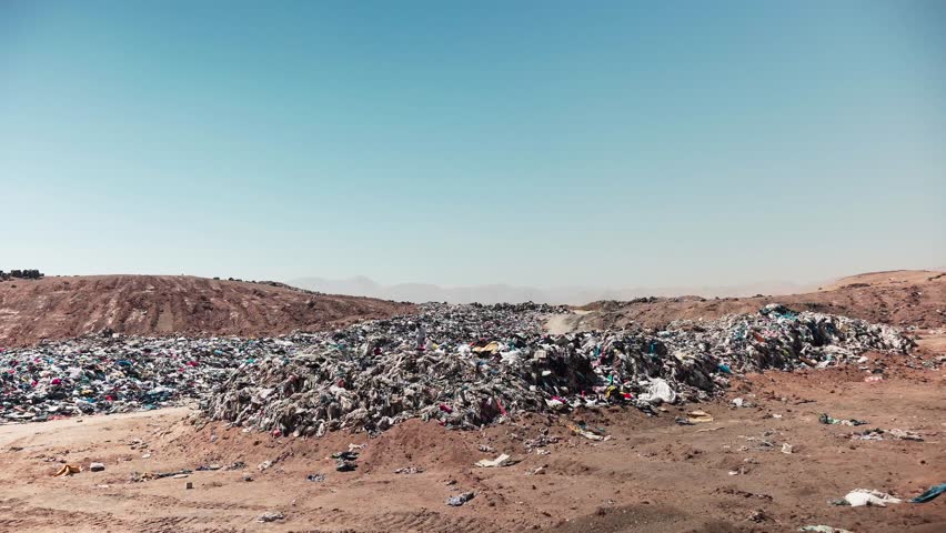 Accumulation of second-hand clothes in clandestine landfill generating a garbage dump in the Chilean desert