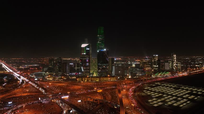 king Abdullah Financial Center in Riyadh city at night with high traffic street. Royalty-Free Stock Footage #3391494513