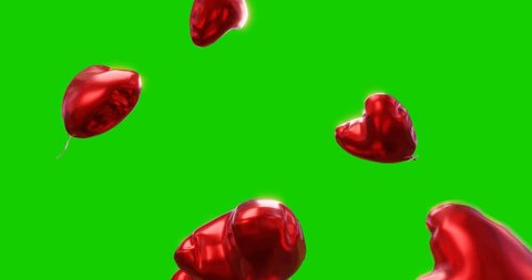 Heart-shaped helium foil balloons float upwards against a green screen. 3 different colors in one video: red, pink and gold. Video de stock