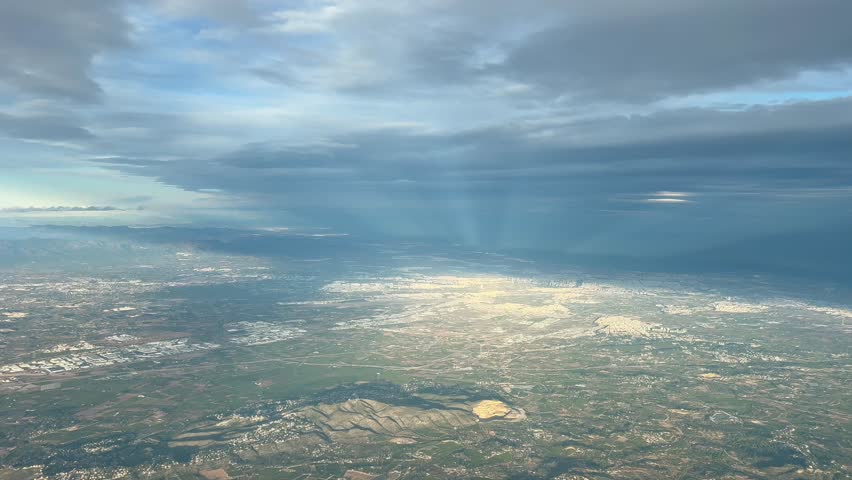 Biclical sky over Valencia city, Spain, shot from an airplane cabin flying at 4000m hifg. A pilot’s perspective.
