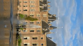 View of the Binnenhof House of Parliament and the Hofvijver lake with downtown skyscrapers in background. The Hague, Netherlands. Camera pan - Powered by Shutterstock - Get 15% off with code: PIKWIZARD15