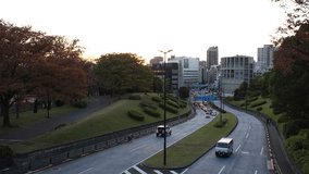 SHIBUYA, TOKYO, JAPAN - NOVEMBER 2023 : View of sunset sky near Yoyogi park. Nature and city life concept video.