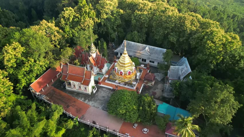 Wat Phra That Sob Fang is situated in Amphoe Mae Ai, Chiang Mai, Thailand. It was build almost 1,300 years ago which contain Buddha forehead bone and renovated for several time. Royalty-Free Stock Footage #3391609401