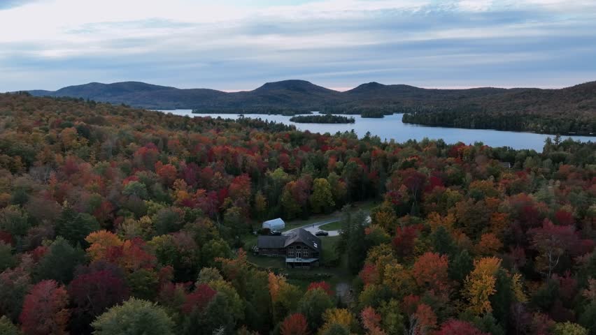 Autumn Season Over Raquette Lake Village In Long Lake, Hamilton County, New York, United States. Aerial Drone Shot