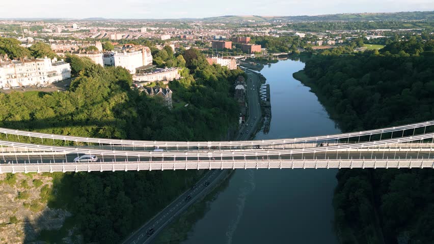 Aerial reverse reveal of Clifton Suspension bridge designed by Isambard Brunel in 1864 near Bristol, England, UK