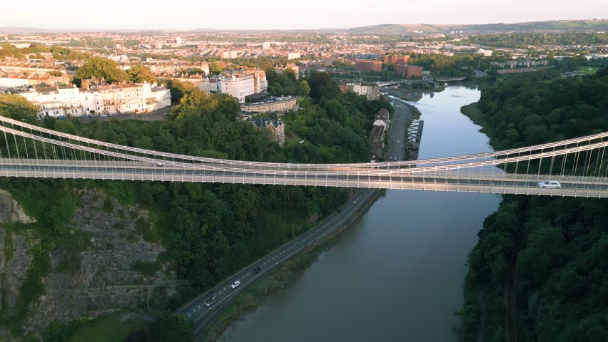 Aerial reverse reveal of Clifton Suspension bridge designed by Isambard Brunel in 1864 near Bristol, England, UK