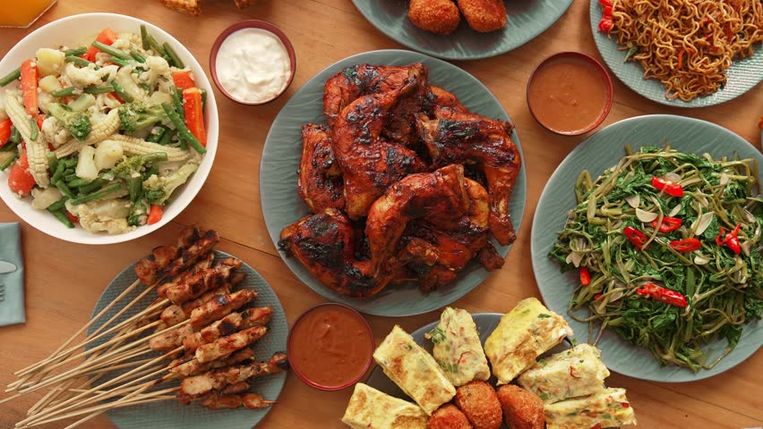 Eating Fresh Meal of Traditional Asian Food on Family Table. Cooking Healthy Delicious Cuisine in Asia Style. Appetizer of Seasoned Chicken Meat Served with Vitamin Vegetables and Yummy Japan Omelette