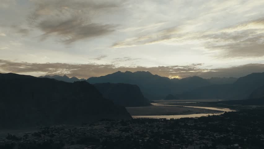 Aerial view of Skardu, the Indus river and mountains during the sunrise golden hour, Himalayas, Gilgit Baltistan, Pakistan.