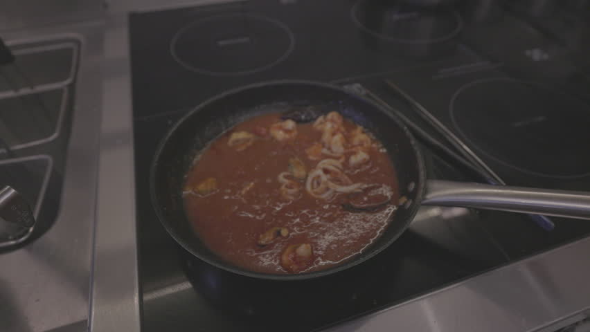Italian Pasta Cooking Process. Cooked pasta is mixed with sauce and toppings in a hot pan. Italian cuisine, traditional recipe. Slow motion 120 fps, ProRes 422, 10 bit, ungraded C-LOG video | Shutterstock HD Video #3391983121