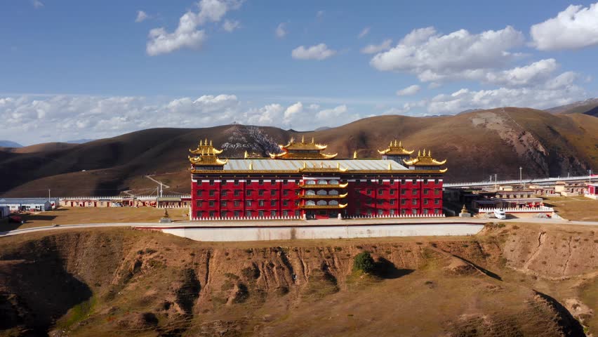 Royal red palace with gold trim in Tagong grasslands, Tibetan Sichuan Western China