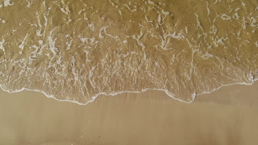 Drone Shot Of Captivating Waves on a Summer Shore