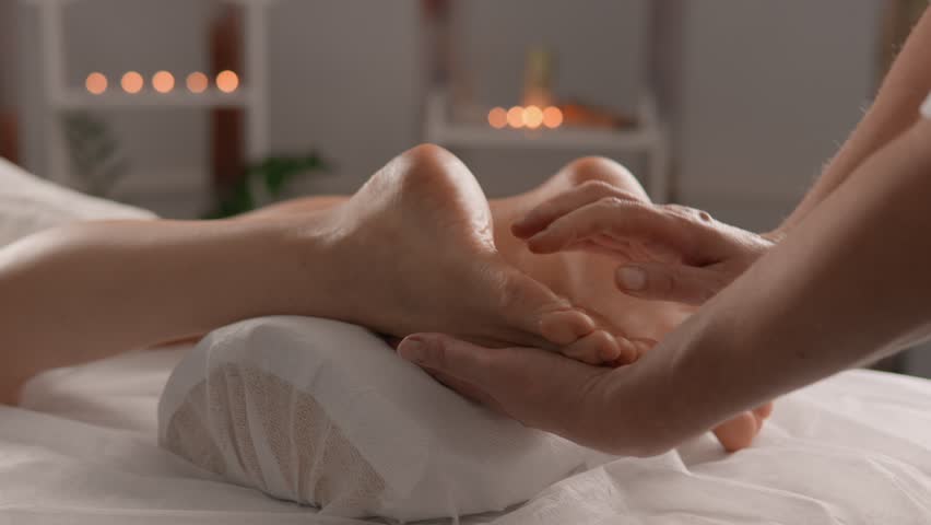 Restore flexibility and vitality of your feet with massage that promotes relaxation and regains elasticity. Deepen inner harmony during a massage, where color vibrations help you find energy and joy. Royalty-Free Stock Footage #3392073575