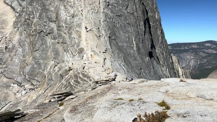 The backside of Half Dome in Yosemite National Park with the cable climbing system