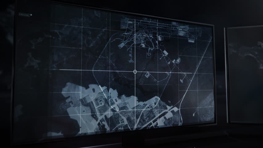 Multiple computer screens. Recent Spying technology. User Interface. Location Track. Destination Approved. Radar Data. The footage from the Australian Military Base is being shown on the monitor.