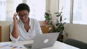 Frustrated african-american businesswoman worrying about project, sitting at the desk in front of laptop, depressed female employee feeling stress by mistake or unexpected computer error crash - Powered by Shutterstock - Get 15% off with code: PIKWIZARD15