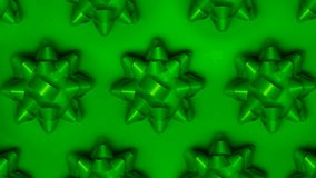 Set of foil spinning bows isolated on green background. Ballet of present decoration for holiday. Gift artistry, stop motion animation magic. - Powered by Shutterstock - Get 15% off with code: PIKWIZARD15