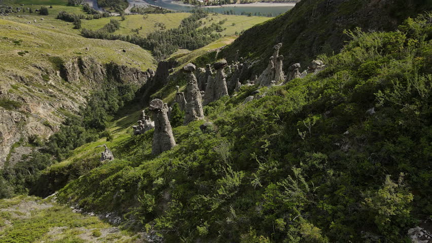 Aerial view of natural rock formations Stone mushrooms in the Altai Nature Reserve in the Chulyshman River valley. Soil erosion. Tourist attraction. Close up
