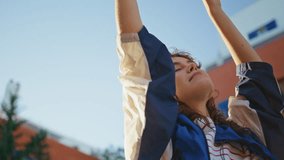 Girl in headphones dancing sunlight raising hands up closeup. Serene gentle woman listening music in earphones at sunny street. Romantic teenager enjoy song in headset at summer weekend outdoors. - Powered by Shutterstock - Get 15% off with code: PIKWIZARD15