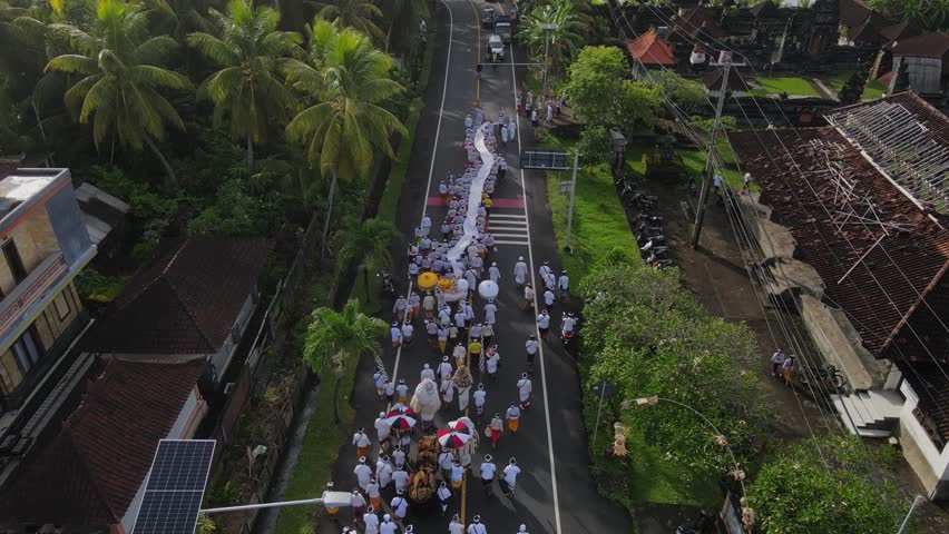 Balinese ceremony walking on the street at sunny day, Bali, Indonesia | Shutterstock HD Video #3392414423