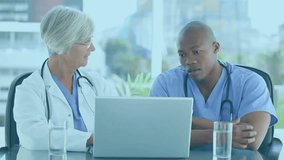 Animation of data processing over diverse doctors with laptop. Global medicine, connections, computing and data processing concept digitally generated video.