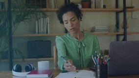 Animation of binary coding data processing over biracial woman suing laptop. Global connections, computing and data processing concept digitally generated video. - Powered by Shutterstock - Get 15% off with code: PIKWIZARD15