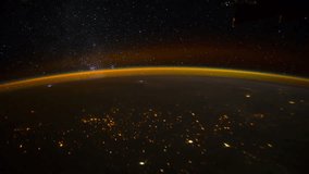 ISS view of rotating planet earth with aurora and star galaxy. Created from Public Domain images, courtesy of NASA JSC : http://eol.jsc.nasa.gov. Zoom in
