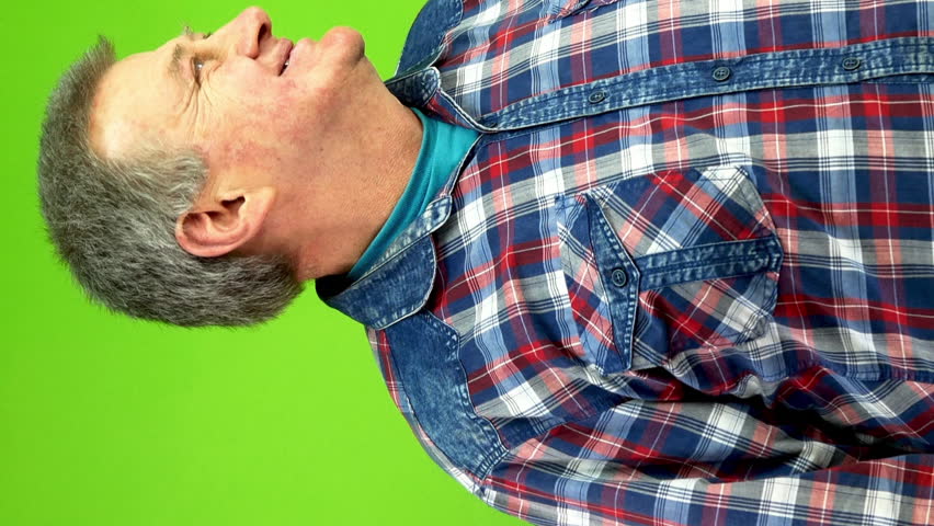 Senior smiling man sees something and gets very upset to point of cry.