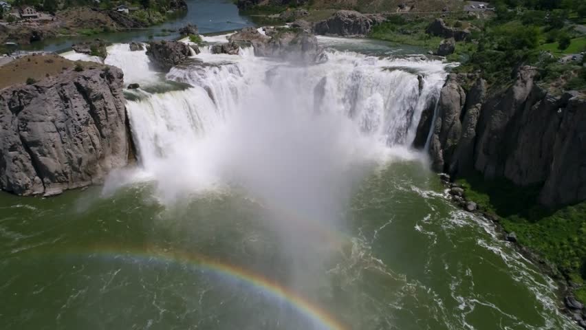 A 4K drone shot of Shoshone Falls, a raging waterfall, which often reflects rainbows, located along the Snake River, only 3 miles away from Perrine Bridge and Twin Falls, Idaho.