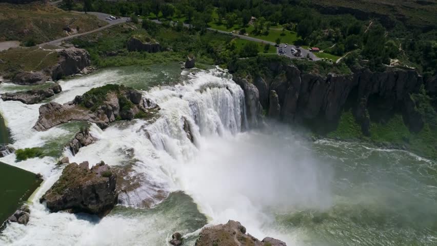 A 4K drone shot of Shoshone Falls, a raging waterfall, which often reflects rainbows, located along the Snake River, only 3 miles away from Perrine Bridge and Twin Falls, Idaho.