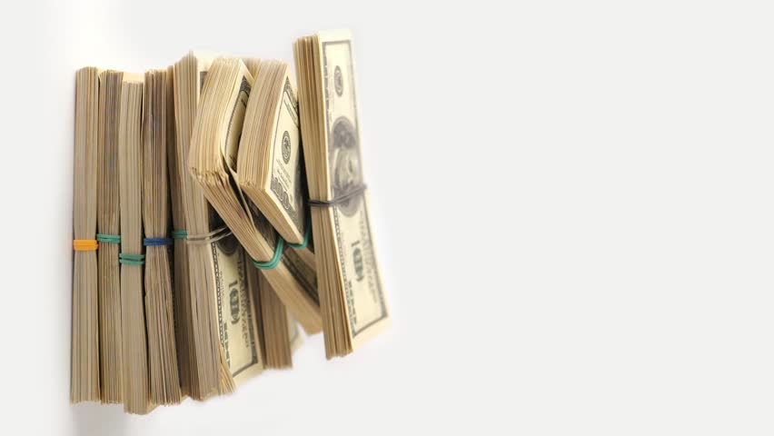 Dollars money down, decrease in income, losses concept. Vertical video of stacks of hundred dollar bills disappearing from large pile of US dollars money. Close up, copy space