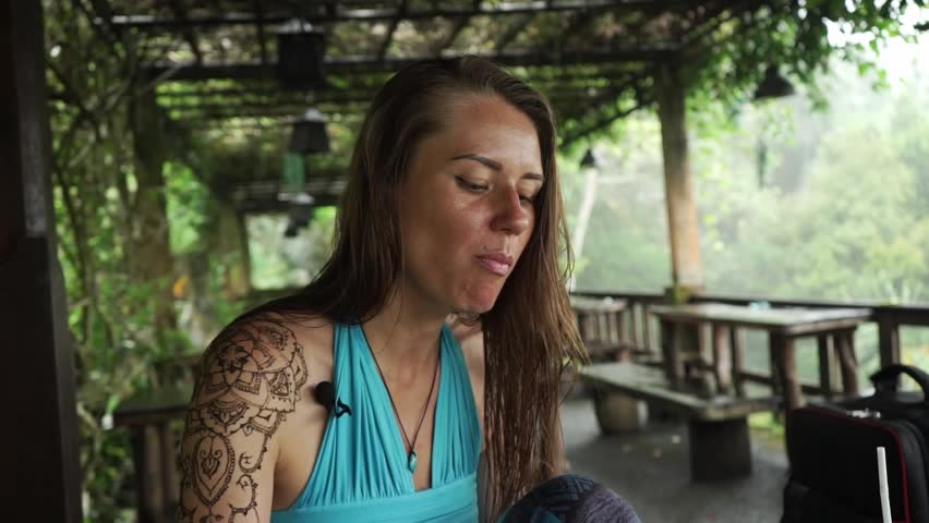 A girl eats nasi goreng. Asian food. Bali.