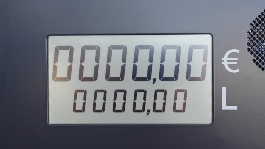 Closeup of petrol pump display counting Euros and gas litres. Inflation and transport price concept.