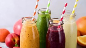 Fresh fruit smoothies bottles with straws. Healthy detox drinks - Powered by Shutterstock - Get 15% off with code: PIKWIZARD15